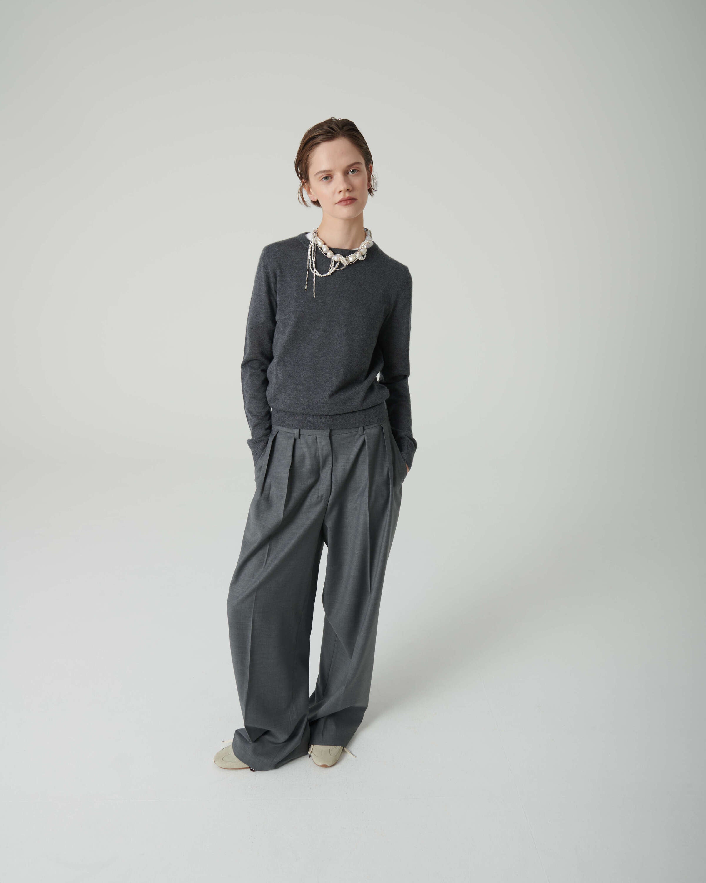 deep grey sweater with zip on the back