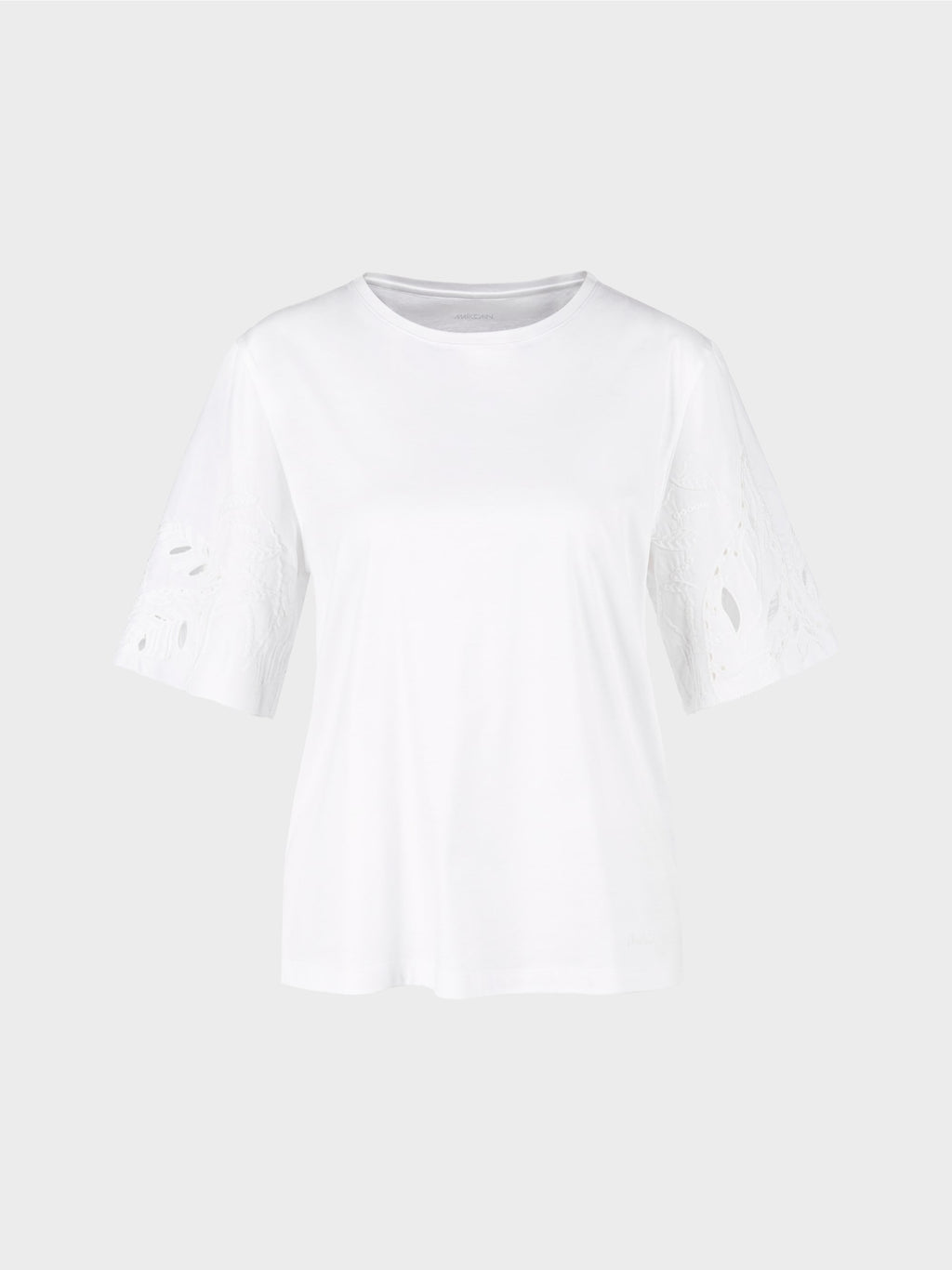 white T-shirt with eyelet embroidery