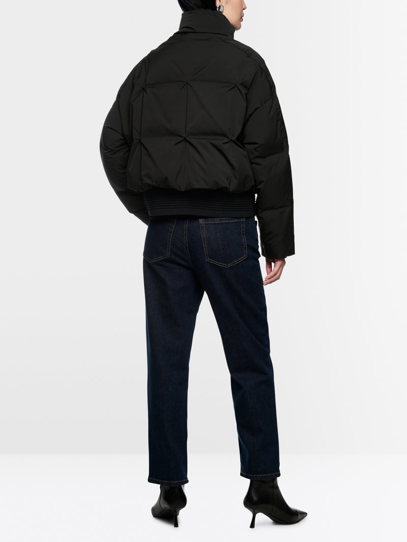 black quilted down jacket with knitted cuffs