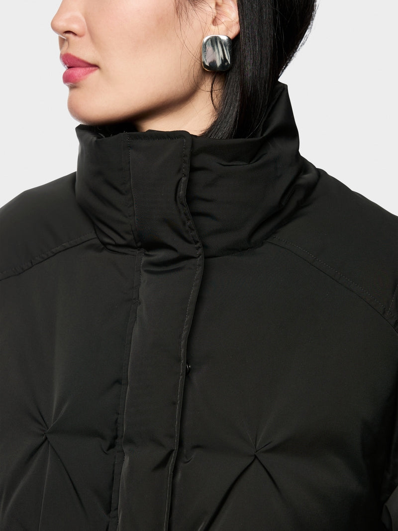 black quilted down jacket with knitted cuffs