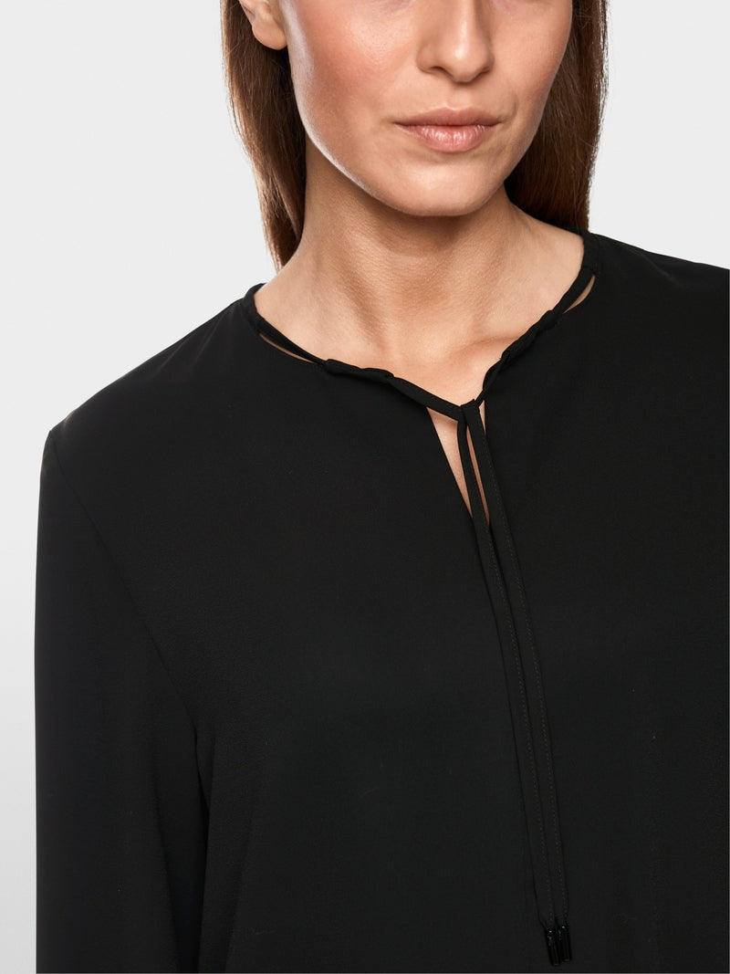 black flowing slip-on blouse